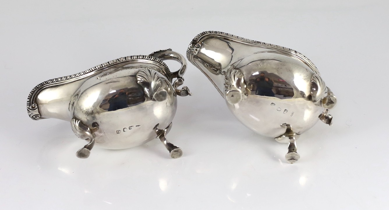 A near pair of George III silver sauceboats